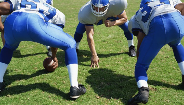 high angle view of four football players playing