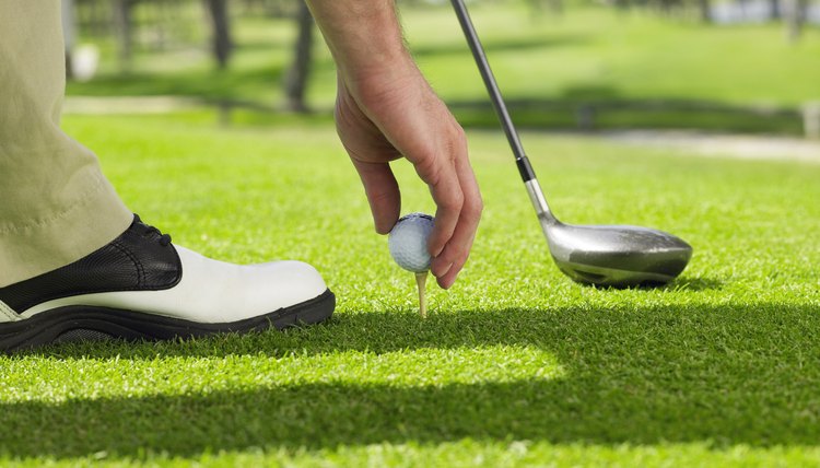 You can switch your ball anytime between holes, but after teeing off on a given hole, it's a different story.