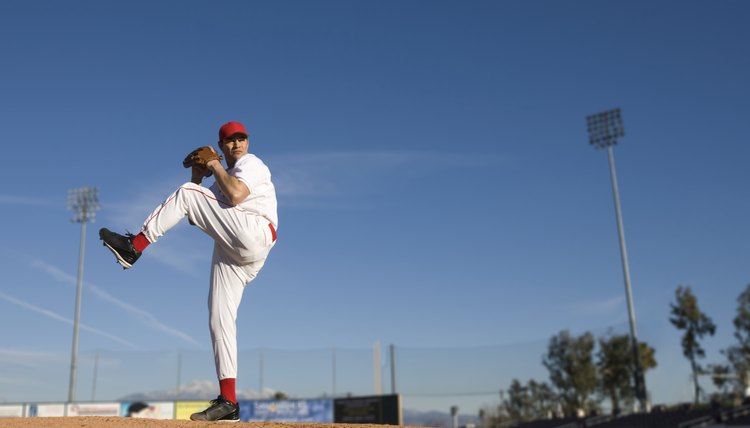 USA, California, San Bernardino, baseball pitcher throwing pitch, outdoors