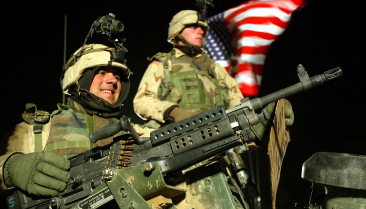 Corporal and PFC of the 101st. Airborne division on top of a humvee