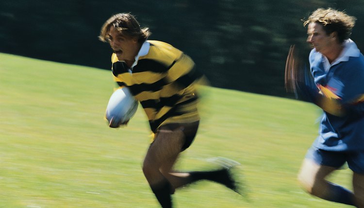 Men playing rugby