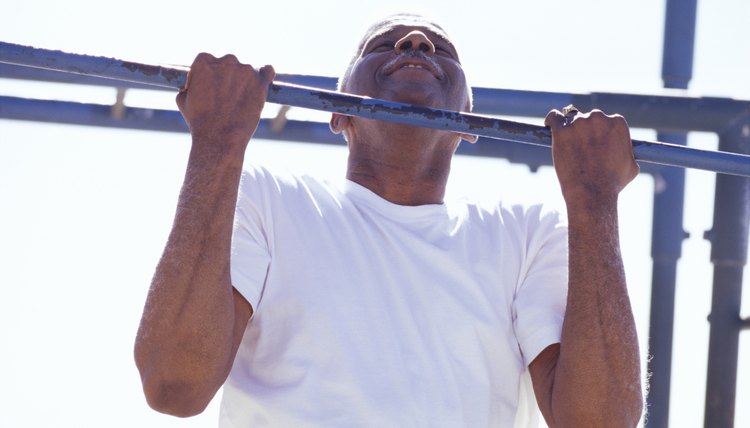 Senior man doing a chin-up