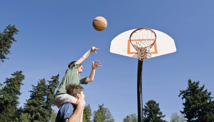 Father and son playing basketball