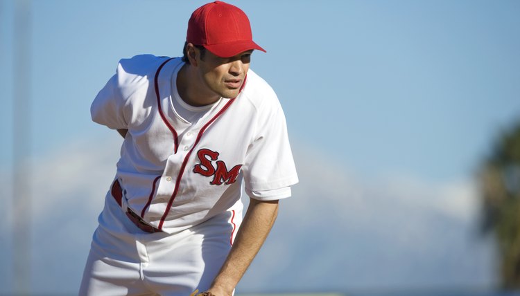 USA, California, San Bernardino, baseball pitcher preparing to throw, outdoors