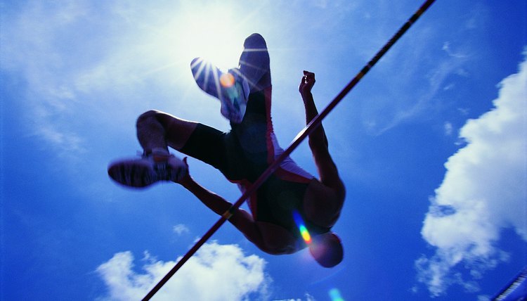 Athlete going over bar in high jump