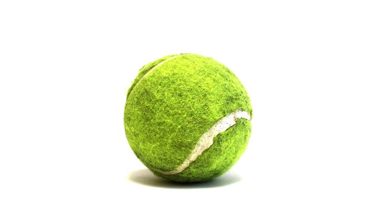 Bright tennis ball on white background