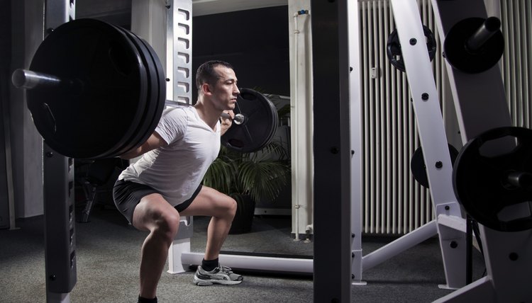 squatting heavy weights in squat rack