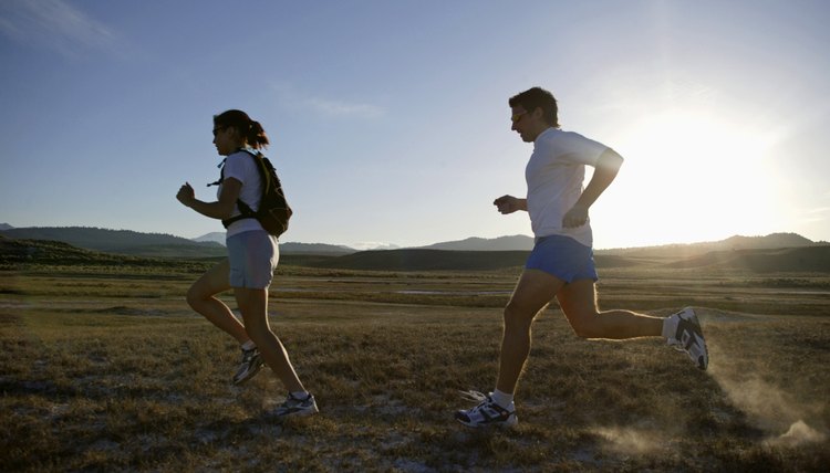 Man and woman running at sunset,  California,  USA