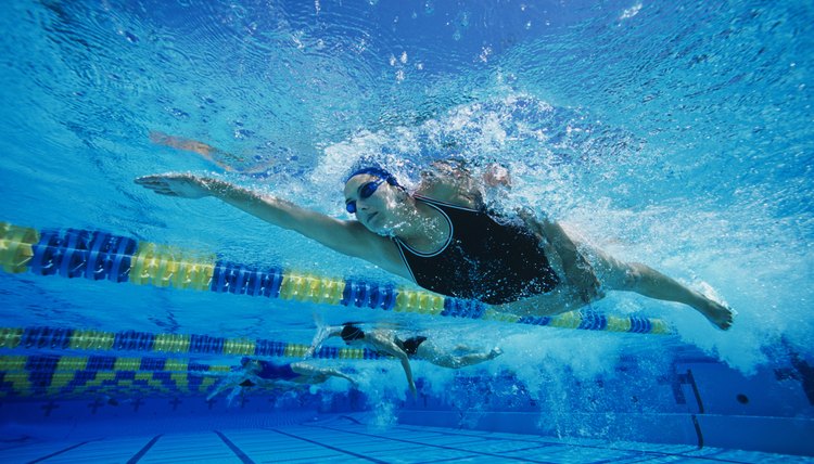 Swimmers Racing in Pool