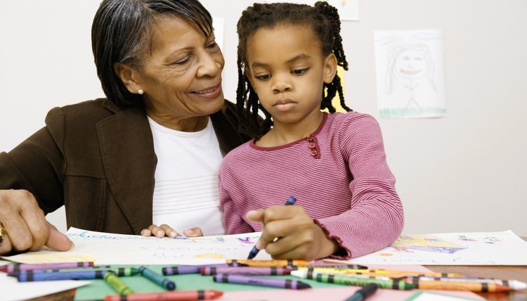 Grandmother and girl coloring