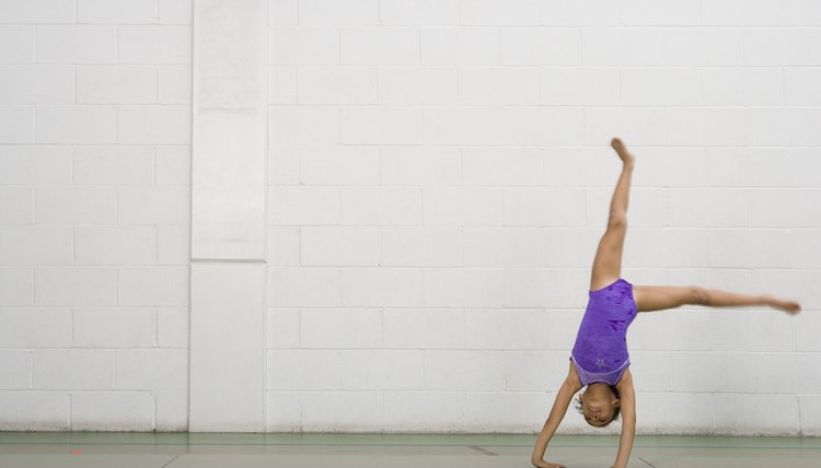 Gymnast girl doing cartwheel
