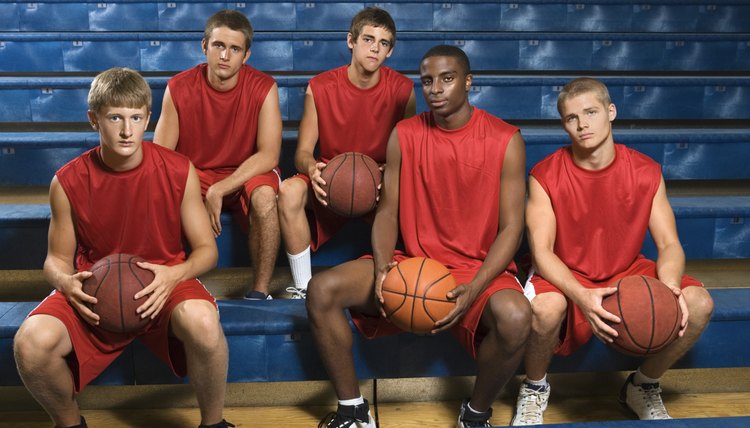 Basketball team sitting in bleachers