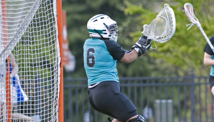 Lacrosse goalie blocking a shot