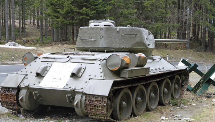 Large military tank in forest