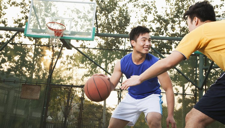 Two street basketball players on the basketball court