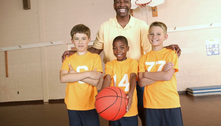 Basketball coach with players