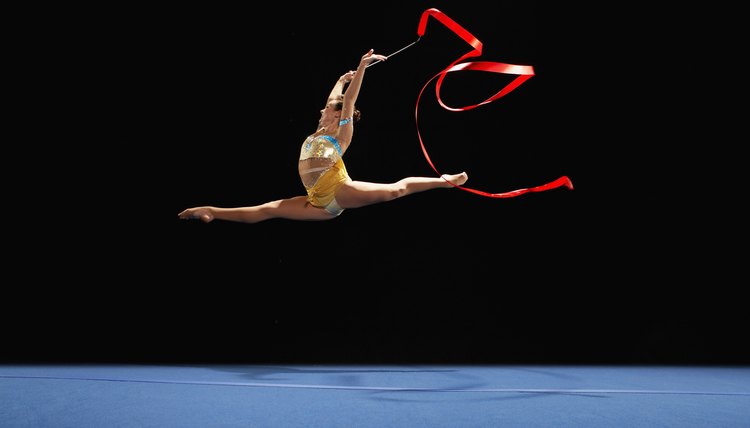 Rhythmic Gymnast Jumping with Ribbon