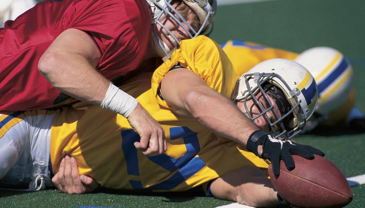 Football players in action on field