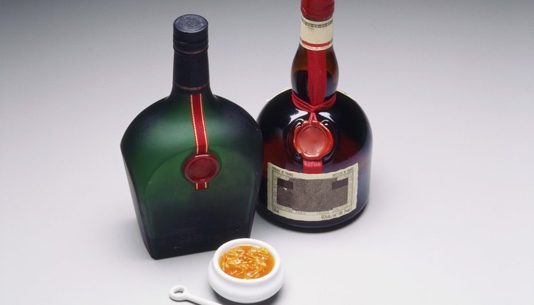 Liqueur and cognac bottles with marmalade