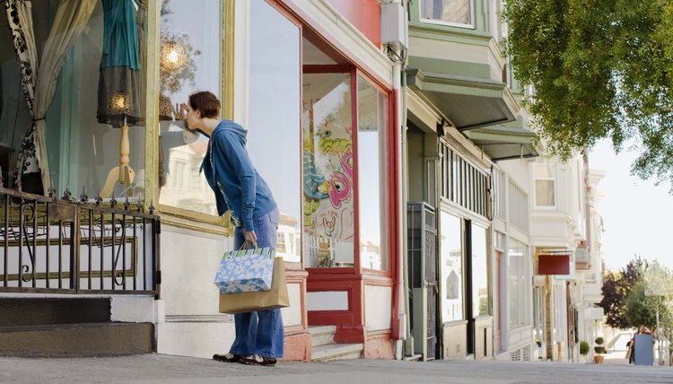 Woman window shopping, North Beach, San Francisco, California