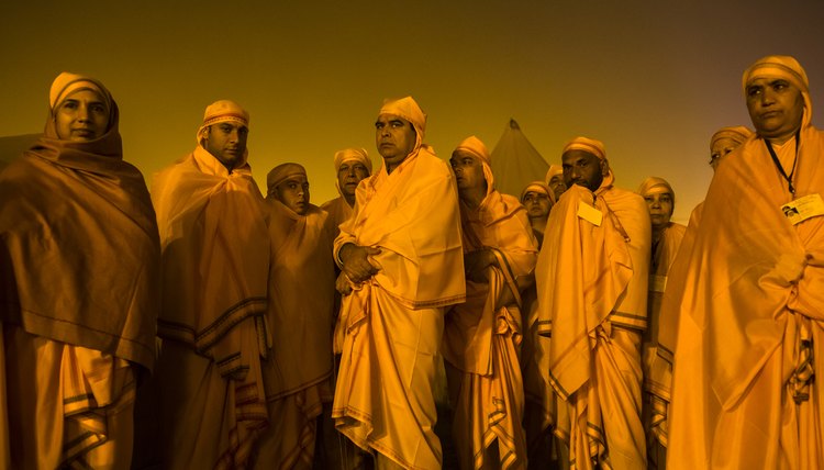 Hindu men and women wait to bathe in the holy Ganges river in India.