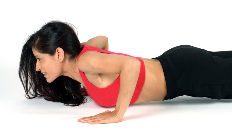 Portrait of a woman doing push ups