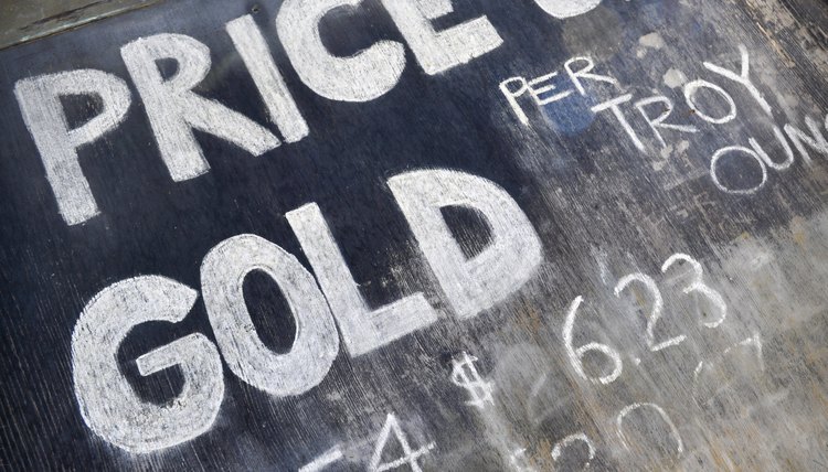 An old gold rush sign showing prices.