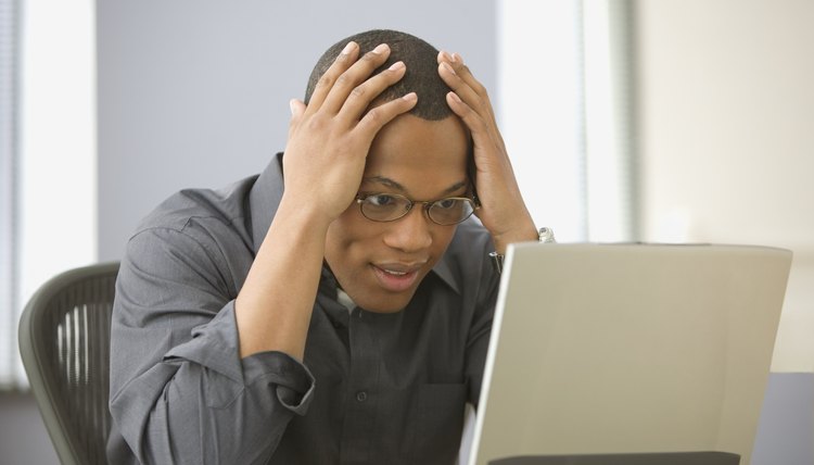 Man looking at computer with perplexed look