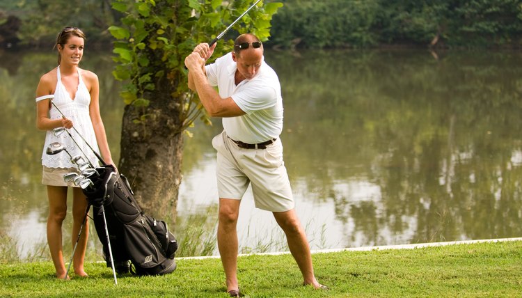 Man swinging golf club