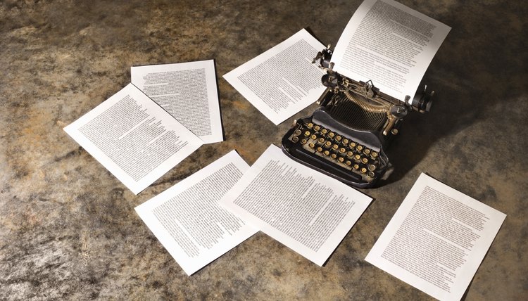 Antique typewriter and pages of text