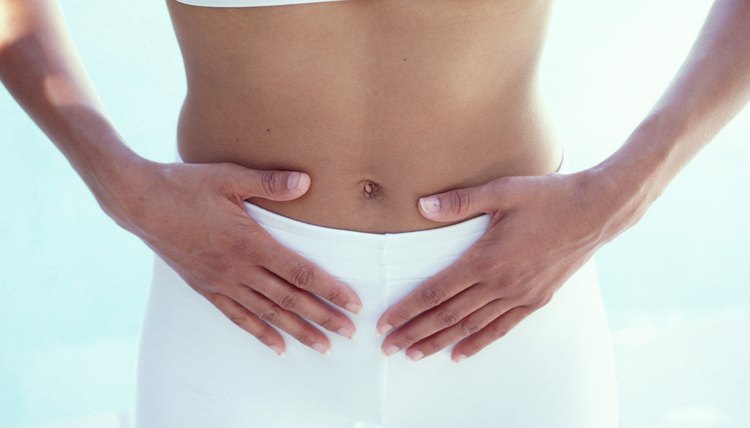 Woman with hands on abdomen