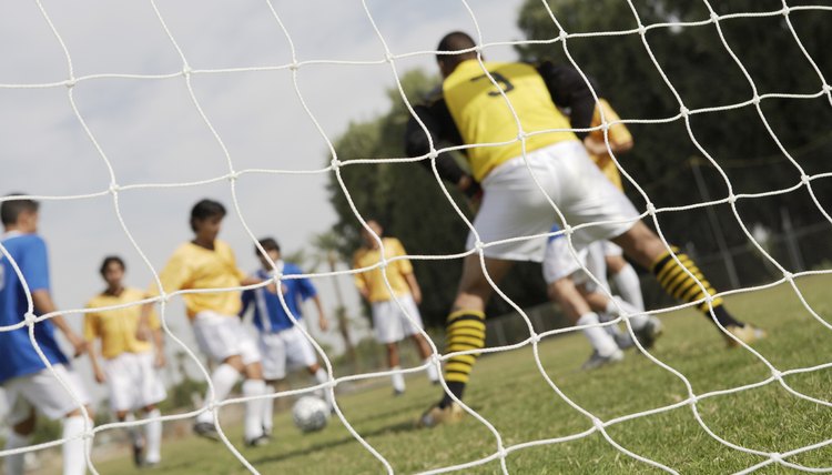 Soccer Players Competing for the Ball