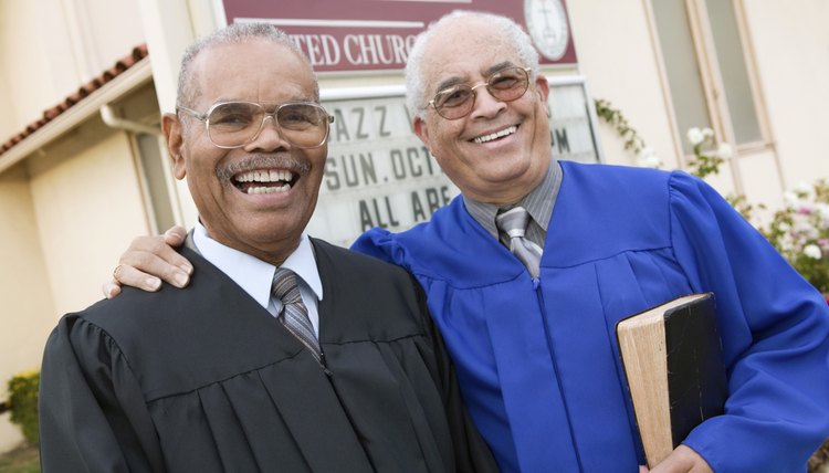 Smiling pastors standing side-by-side
