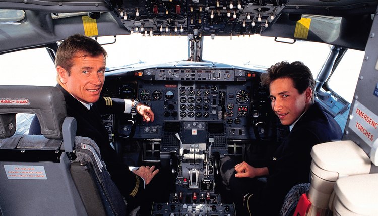Airplane cockpit with pilots