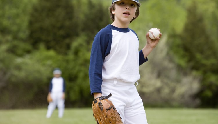 Little leaguer holding ball