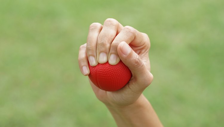 Woman hand squeezing a stress ball