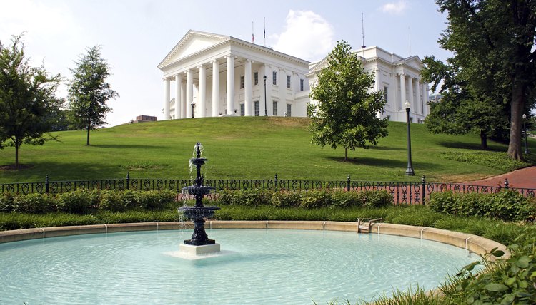 A view of a fountain on the lawn of Virginia's capital building.