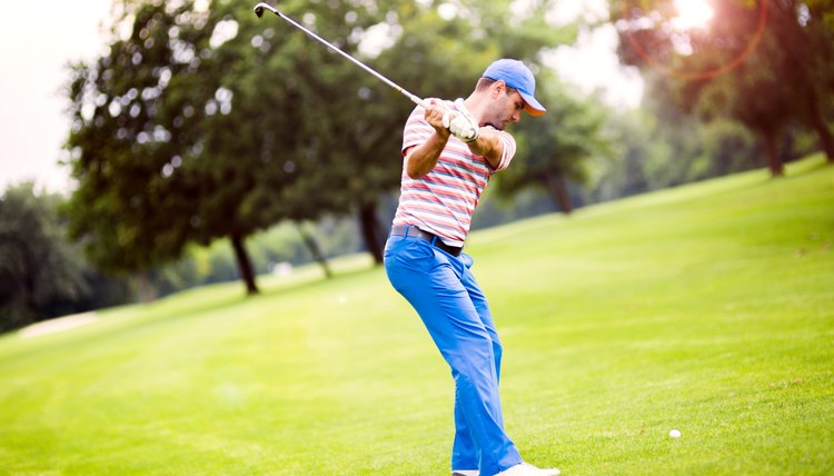 Golfer practicing and concentrating before and after shot