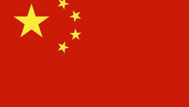 A closeup of China's national flag which represents a country that practices and upholds the laws of Communism