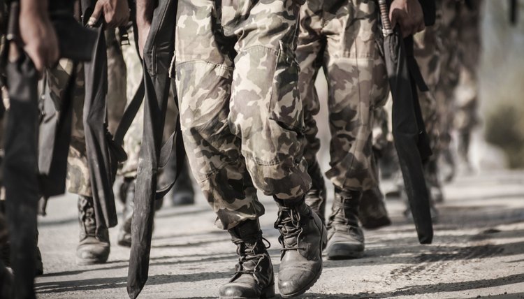 Military soldiers marching on foot