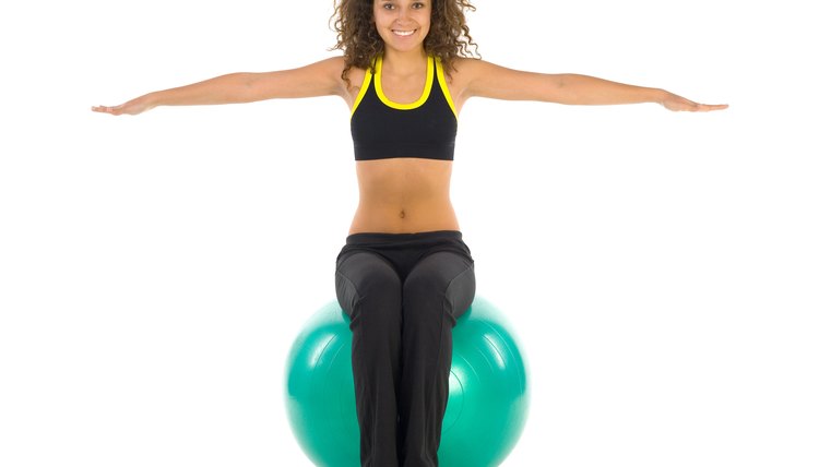 Woman sitting on exercise ball