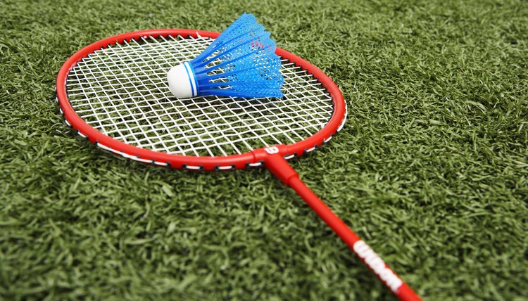 Badminton racket and shuttlecock on artificial turf