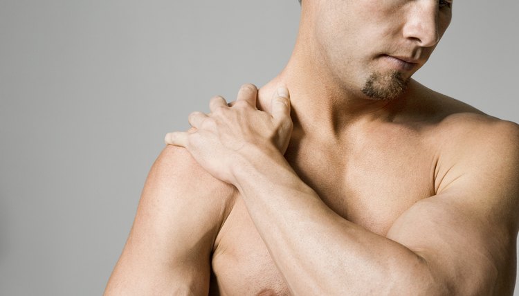 Man massaging shoulder