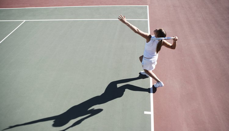 Young woman playing tennis, elevated view