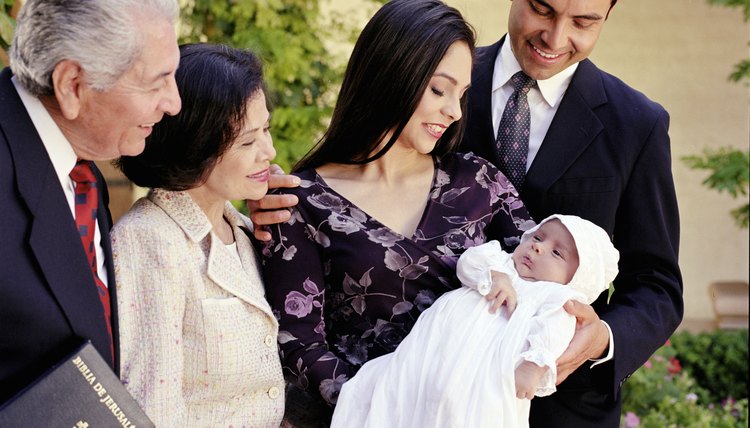 Godparents participate in a baby's baptism in the Greek Orthodox Church.