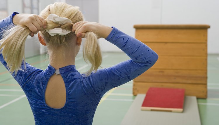 Gymnast girl fixing hair