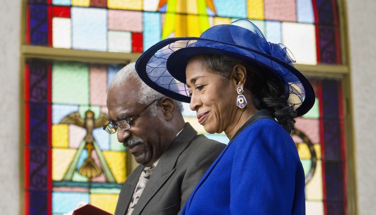 Couple reading Bible in church