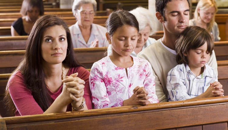 Family praying in church.