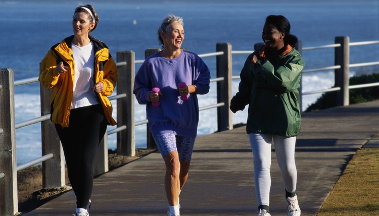 Three Women Running on a Path by a Bay