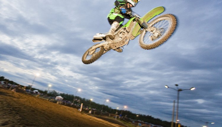 Motorcross rider jumping on track